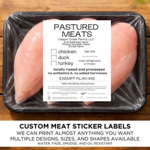 May include: Raw chicken breasts in a black plastic tray, wrapped in clear plastic. A white label reads "PASTURED MEATS" with details about the product, including "locally raised and processed no antibiotics & no added hormones." The bottom text says "CUSTOM MEAT STICKER LABELS".
