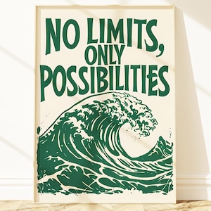 May include: A framed art print with the words "NO LIMITS, ONLY POSSIBILITIES" in green lettering above a green wave illustration. The print has a cream-colored background and is displayed against a white wall with a wooden floor.