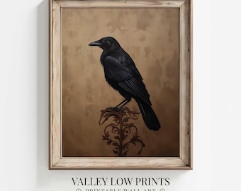May include: A black crow perched on a decorative, ornate, gold-colored metal stand against a brown background. The crow is facing to the left and has a dark, almost black, background.