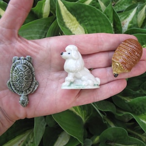 Wade Whimsies vintage miniature Red Rose tea figurines made in Staffordshire, England by Wade Ceramics. Featuring mini porcelain animals and various characters introduced as a promotion inside boxes of Red Rose Tea. Launched in 1954 throughout the UK with later launches in Canada and USA. Sizes are approximately 1-2 inches high. These whimsical, nostalgic figurines are in good vintage condition and highly collectible.