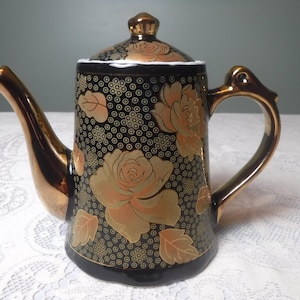 Vintage Black Porcelain Teapot: Gold Floral Design