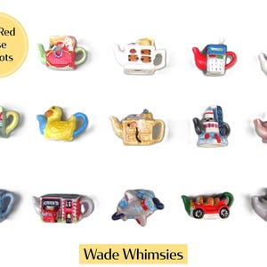 May include: A collection of fifteen miniature ceramic teapots featuring diverse shapes including a duck, a church, a car, an aeroplane, and various building designs. The set is labelled Mini Red Rose Teapots and Wade Whimsies, showcasing colourful hand-painted details on each small figurine.