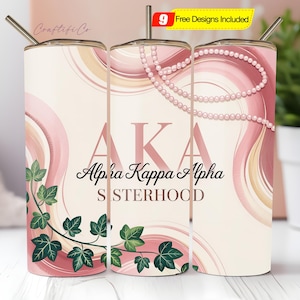 May include: A set of three stainless steel tumblers with lids and straws. The tumblers feature a pink and cream design with the text "AKA Alpha Kappa Alpha SISTERHOOD". The design includes ivy and a pearl necklace.