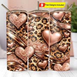 May include: Three stainless steel tumblers with a leopard print design, adorned with rose gold hearts and accents. Each tumbler has a straw and the text "9 Free Designs Included" on a yellow banner.