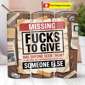 May include: A stainless steel tumbler with a humorous design. The tumbler features a distressed wood background with a sign that reads "MISSING FUCKS TO GIVE." The design includes the text "HAS ANYONE SEEN THEM?" and "SOMEONE ELSE."