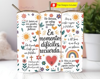 May include: A white tumbler with a floral and rainbow design, featuring Spanish text. The tumbler includes a stainless steel straw and a lid. The design incorporates hearts, flowers, and suns. The text includes phrases like "En momentos difíciles, recuerda..." and other inspirational quotes.