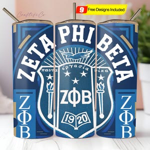 May include: A set of three blue and white Zeta Phi Beta tumblers with a straw. Each tumbler features the sorority's crest, Greek letters, and the text "9 Free Designs Included". The design includes torches, stars, and the founding year, 1920.