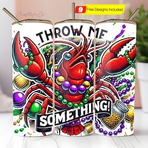 May include: A set of three white insulated tumblers with a vibrant crawfish design. The crawfish is red with green and purple accents, surrounded by beads and the text "THROW ME SOMETHING!". Includes a straw and a lid.