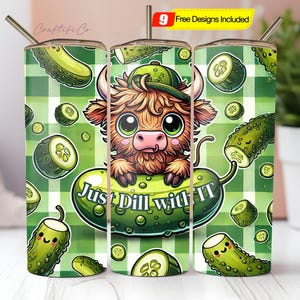 May include: A tumbler with a whimsical design featuring a cartoon Highland cow wearing a green cap, surrounded by pickles and cucumber slices on a green plaid background. The text "Just Dill with it" is on a pickle.