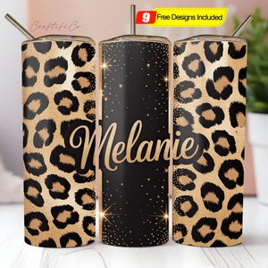 May include: A set of three stainless steel tumblers with lids and straws. Two tumblers feature a leopard print design in shades of tan and black. The center tumbler is black with gold stars and the name "Melanie" in gold script. A yellow banner reads "9 Free Designs Included."