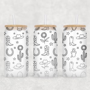 May include: Three glass tumblers with a cowboy theme. Each tumbler has a wooden lid and a straw. The tumblers are decorated with black and white line drawings of cowboy boots, hats, cacti, horseshoes, and stars.