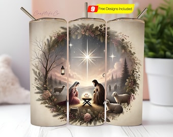 May include: A stainless steel tumbler with a detailed Nativity scene illustration. The design features Mary, Joseph, baby Jesus, sheep, and a bright star. The tumbler has a silver straw and a lid. The words "Craftifi Co" are on the side.