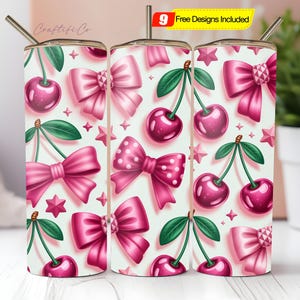 May include: Three stainless steel tumblers with a repeating pattern of pink bows, cherries, and stars on a white background. Each tumbler has a silver straw and a lid. The tumblers are decorated with a cute, girly design.