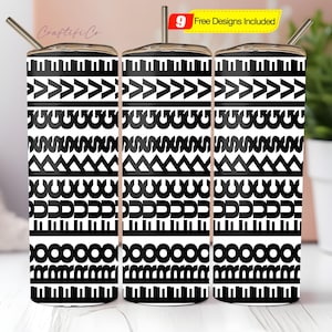 May include: Three stainless steel tumblers with black and white geometric patterns. Each tumbler has a silver straw and a lid. The design includes arrows, curves, and piano key-like shapes. A small yellow tag indicates "9 Free Designs Included".