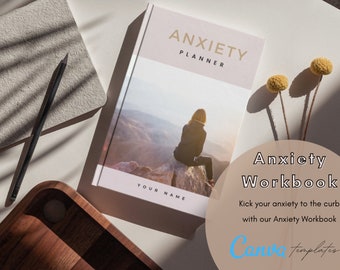 May include: A pink and white planner with the text "ANXIETY PLANNER" and "YOUR NAME" on the cover. The planner is open to a page with a photo of a person sitting on a rock overlooking a mountain range. The text "Anxiety Workbook" is on a beige circle with a blue and white "Canva templates" logo below it.