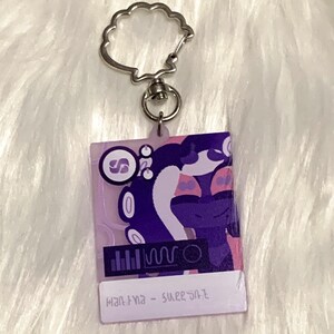 May include: Purple and pink keychain with a cartoon character and the text "mantra - sweet salt".
