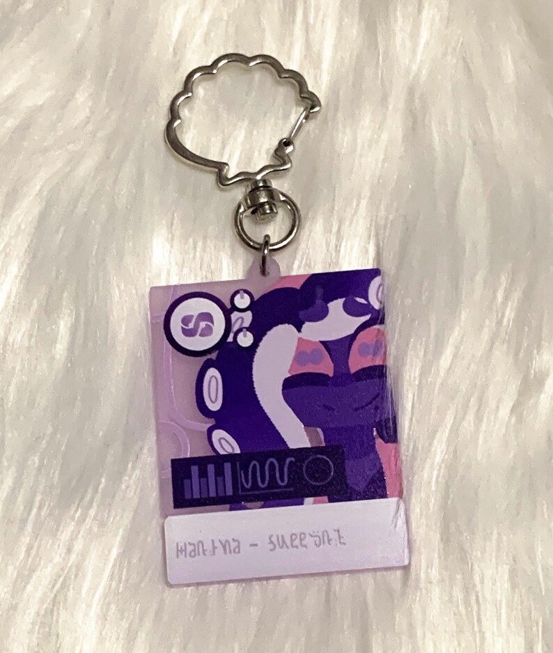 May include: Purple and pink keychain with a cartoon character and the text "mantra - sweet salt".