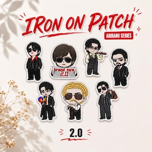 May include: Seven embroidered iron-on patches featuring stylized cartoon characters in suits and sunglasses. The text reads IRON ON PATCH, ARIRANG SERIES, and 2.0. One character holds a sign saying brand new 2.0, another a lollipop, and one a cane.