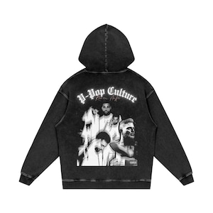 May include: Black hooded sweatshirt with a faded, vintage look. The back features a grayscale graphic of several men and the words "K-Pop Culture" in white gothic lettering. The sweatshirt has a drawstring hood and long sleeves.