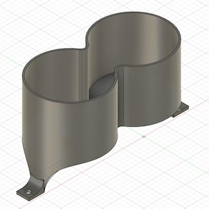 May include: A grey, dual-cylinder cup holder insert with a figure-eight shape. The object features two connected circular compartments and two small, flat mounting tabs at the base, each containing a single circular hole for attachment purposes.