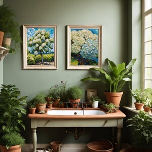 May include: A bathroom with a white porcelain sink and a green wall. There are two framed paintings of white flowers, and several potted plants.