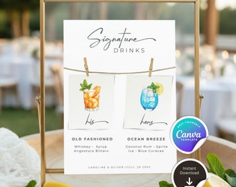 May include: A gold framed sign with the words "Signature Drinks" in elegant script. The sign features two drink illustrations, "Old Fashioned" and "Ocean Breeze", with ingredients listed below. The sign includes the names "Caroline & Oliver" and the date "July, 26 20XX".
