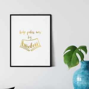 May include: A framed print with gold lettering that reads "ridge pickers wear big knickers" with a gold illustration of a pair of underwear.