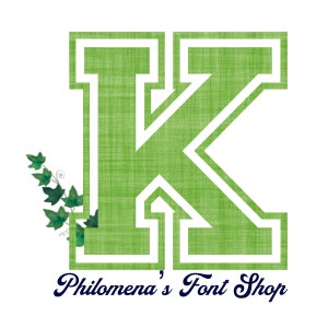 May include: Green letter K with a white outline, in a varsity style font. The letter is on a white background with a green ivy vine to the left. The text "Philomena's Font Shop" is below the letter in a navy blue font.