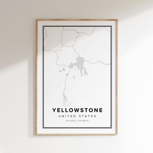 May include: A black and white map print of Yellowstone National Park in the United States. The map is framed in a light wood frame. The text "Yellowstone, United States, 44.428°N / 110.588°W" is printed below the map.