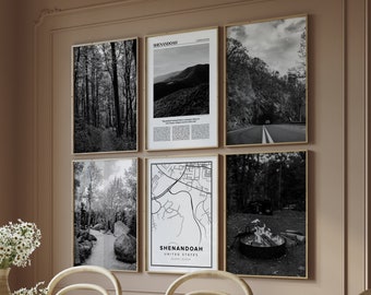 May include: Six framed black and white landscape prints hang on a wall. The prints depict forest scenes, a mountain range, a road tunnel, a map of Shenandoah, and a campfire. The frames are gold, and the wall is a neutral color.