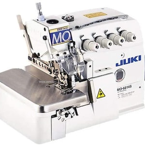 May include: A white Juki MO-6814S serger sewing machine. The machine has a silver work surface and multiple thread spools. The Juki logo is visible in blue. The machine has a warning symbol and the text "6800 Series".