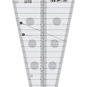 May include: A clear plastic quilting ruler with a 22.5 degree triangle shape. The ruler has a non-slip surface and is marked with inches and fractions of an inch. The ruler is designed by Erin Underwood.