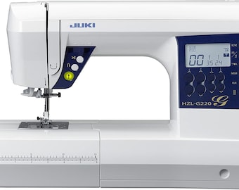 May include: A white JUKI HZL-G220 sewing machine with a blue digital display and control panel. The machine has a needle and foot assembly, a thread guide, and a built-in ruler.