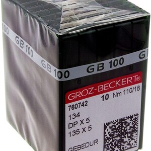 May include: A package of 10 green sewing machine needles, labeled "GROZ-BECKERT®" with the text "10 Nm 110/18", "760742", "134 DP X 5", "135 X 5", "GEBEDUR R B252Y9 AF".