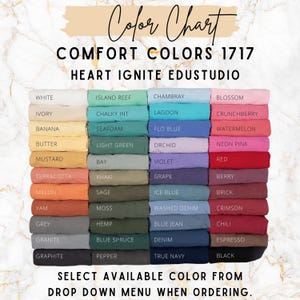 May include: Color chart featuring a variety of Comfort Colors 1717 fabric swatches. The chart displays a wide range of colors, including white, ivory, banana, mustard, terracotta, melon, yam, grey, granite, and graphite. Text at the bottom reads: "SELECT AVAILABLE COLOR FROM DROP DOWN MENU WHEN ORDERING."
