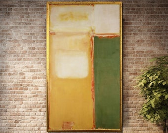 May include: Abstract painting in a gold frame with yellow, white, and green colors. The painting is hanging on a brick wall.