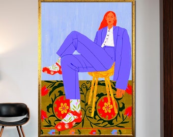May include: A person wearing a purple suit sits on a yellow stool with their legs crossed. They are wearing floral socks and red shoes. The background is a patterned rug with green, gold, and red colours.