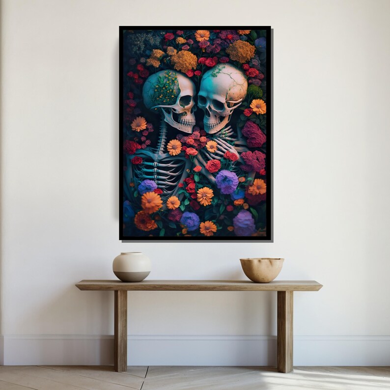 May include: Two skeletons embrace in a field of colorful flowers. The skeletons are intertwined, with their skulls touching. The flowers are a variety of colors, including red, orange, yellow, purple, and blue.