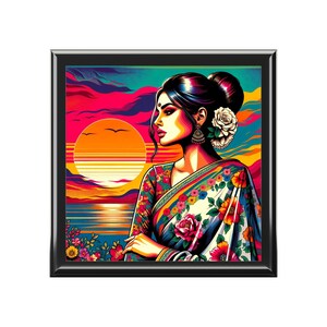 May include: A colourful illustration of a woman in a white and floral patterned sari, standing against a sunset backdrop. The woman has dark hair and is wearing a flower behind her ear. The sunset is a vibrant orange and pink with a blue sky.