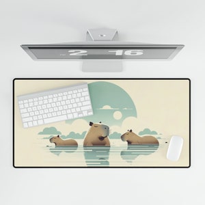 May include: A beige and brown desk mat with a graphic of three capybaras swimming in a blue body of water. The capybaras are brown with white faces and are surrounded by white clouds. The mat has a light beige background and a dark beige border.