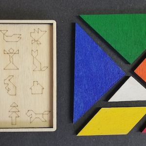 May include: A wooden puzzle with 16 different shapes to be assembled. The puzzle pieces are made of wood and are painted in different colors, including green, blue, red, yellow, orange, and purple. The puzzle is designed to be challenging and fun for people of all ages.