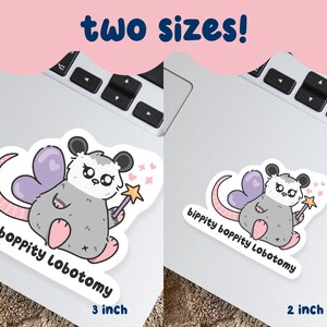 May include: Two stickers featuring a cartoon opossum fairy with purple heart-shaped wings, a star wand, and the text "bippity boppity Lobotomy." One sticker is 3 inches, the other is 2 inches.
