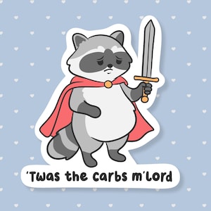 May include: A sticker featuring a cartoon raccoon dressed as a knight, holding a sword. The raccoon wears a red cape and has a sad expression. The text on the sticker reads, "'Twas the carbs m'lord."