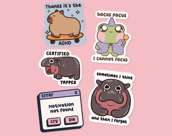 May include: A collection of colorful stickers with cartoon illustrations. One features a capybara on a skateboard with "ADHD" text. Another shows a frog with a wand and the text "I cannot focus". Other stickers include a hippo and error message.