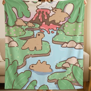 May include: A soft, green and blue blanket featuring a cartoon landscape with dinosaurs, a volcano, and a river. The blanket has a repeating pattern of dinosaurs, trees, and a flowing river. The color palette includes shades of green, blue, brown, and pink.