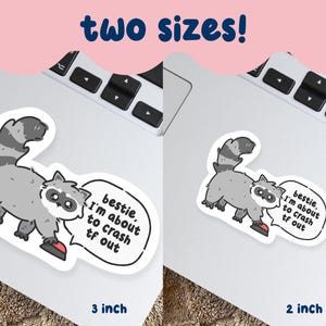 May include: Two stickers showing a cartoon raccoon with a speech bubble saying "bestie, I'm about to crash tf out." Available in 7.6 cm and 5.1 cm sizes. The raccoon is grey and white, with a black and white tail.