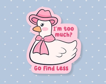 May include: A sticker featuring a cartoon goose wearing a pink cowboy hat and scarf. The goose has rosy cheeks and an orange beak. Text on the sticker reads "I'm too much? Go Find Less" in pink. The background is light blue with white hearts.
