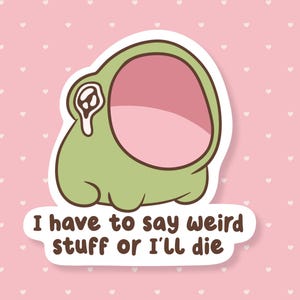 May include: A sticker featuring a cartoon frog-like creature with a large open mouth and a green body. The text "I have to say weird stuff or I'll die" is written on the sticker. The background is pink with white hearts.