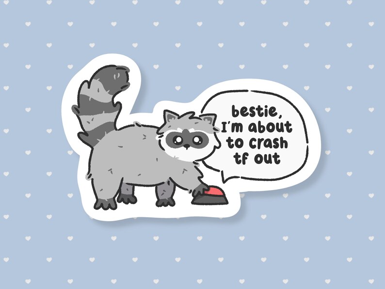 May include: A sticker featuring a cartoon raccoon with a grey body, black mask, and striped tail. The raccoon is reaching for a red button. A speech bubble says, "bestie, I'm about to crash tf out."