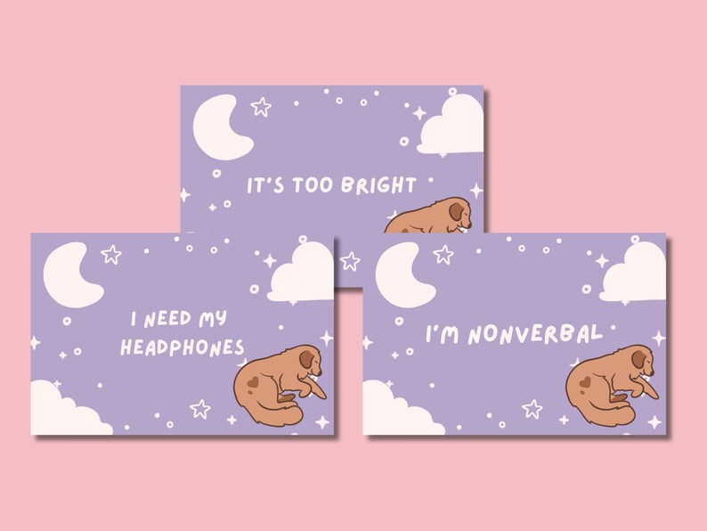 May include: Three lavender-colored cards with illustrations of a sleeping dog, moon, clouds, and stars. Text on the cards reads: "It's too bright," "I need my headphones," and "I'm nonverbal."